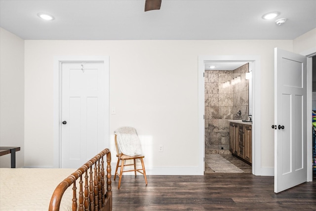 unfurnished bedroom with connected bathroom, tile walls, and dark hardwood / wood-style floors