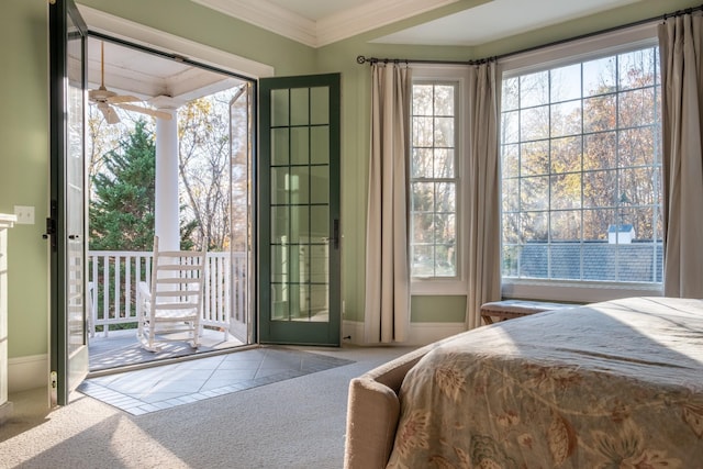 carpeted bedroom featuring access to exterior and ornamental molding