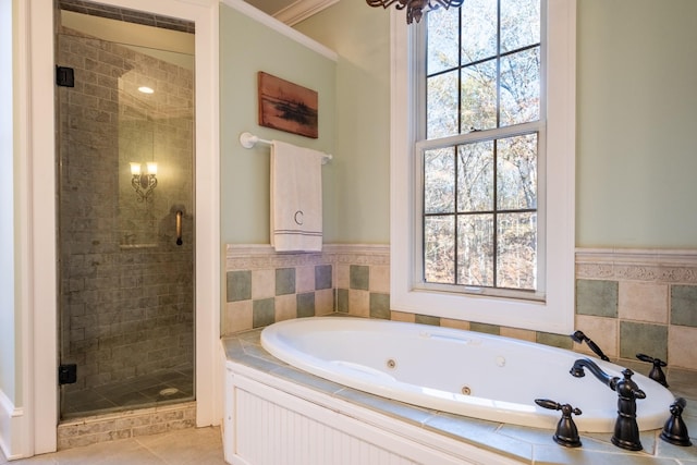 bathroom featuring tile patterned flooring and shower with separate bathtub