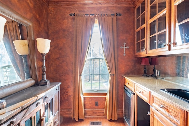 kitchen with light stone countertops and wood-type flooring