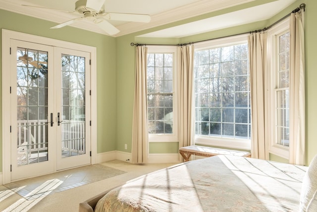 bedroom featuring multiple windows, french doors, and access to exterior