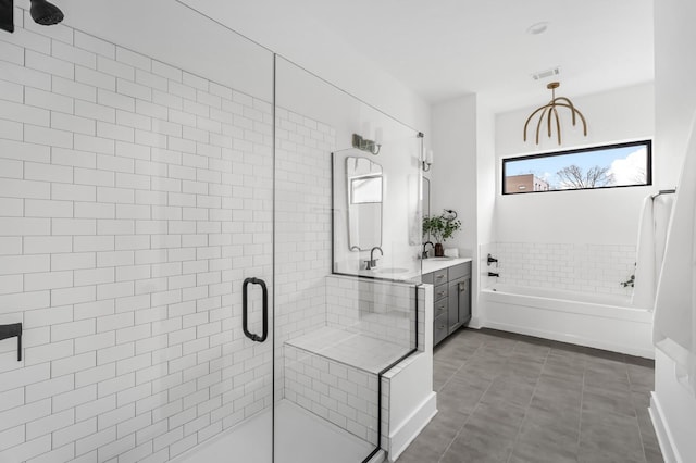 bathroom with vanity and independent shower and bath