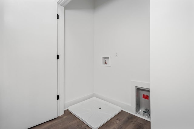 washroom featuring hookup for a washing machine and dark hardwood / wood-style floors