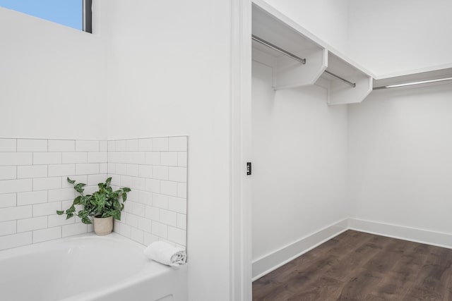 walk in closet featuring dark hardwood / wood-style flooring