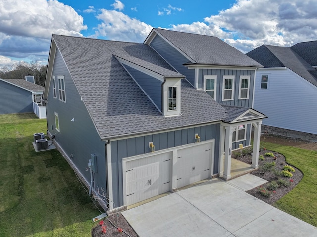 view of front of home featuring a front yard and a garage