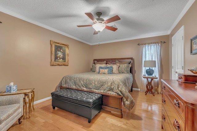 bedroom with a textured ceiling, light hardwood / wood-style floors, ceiling fan, and ornamental molding