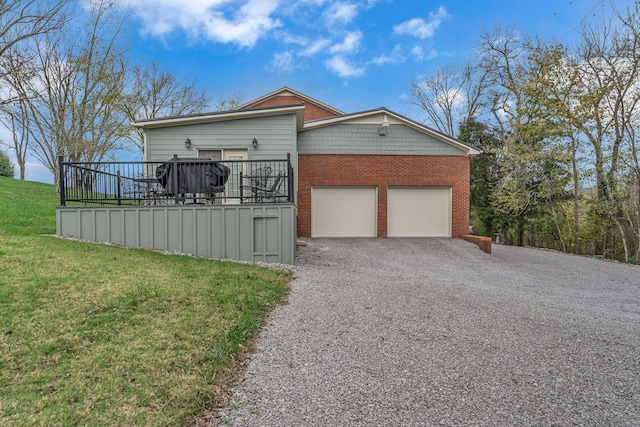 view of side of property with a lawn and a deck