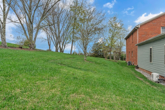 view of yard with central AC