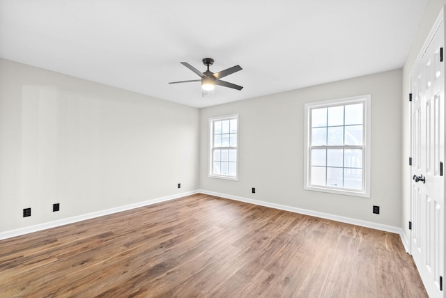 spare room featuring ceiling fan and wood-type flooring