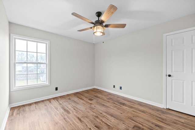 unfurnished room featuring ceiling fan and hardwood / wood-style floors