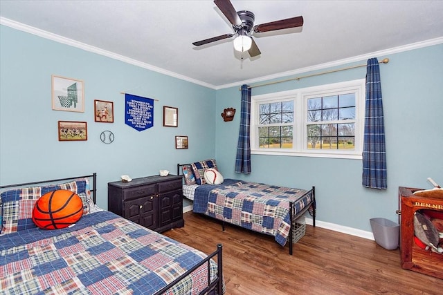 bedroom featuring hardwood / wood-style flooring, ceiling fan, and crown molding