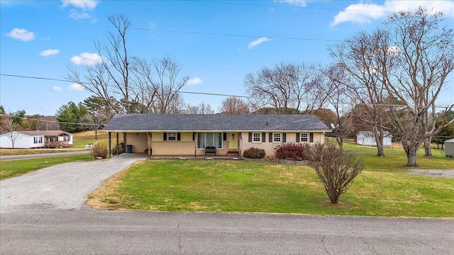 ranch-style house with a front lawn and a carport