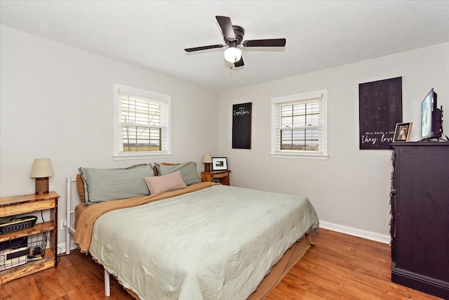 bedroom featuring wood-type flooring and ceiling fan