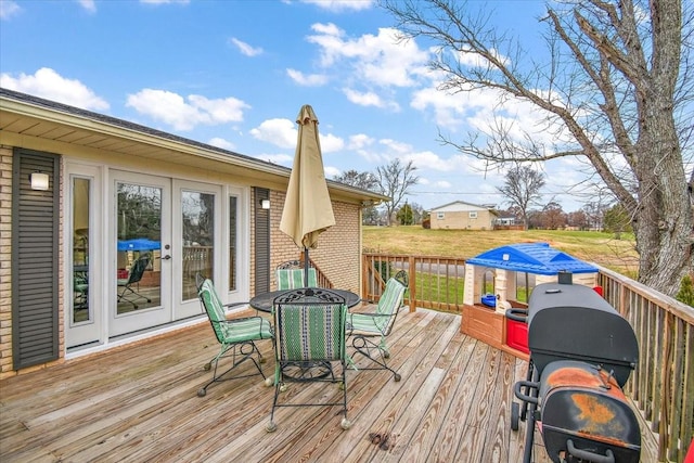 wooden terrace featuring grilling area