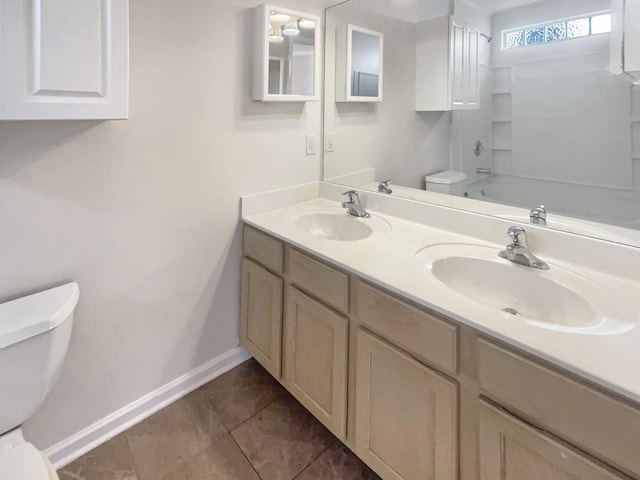 full bathroom with tile patterned flooring, vanity, tub / shower combination, and toilet