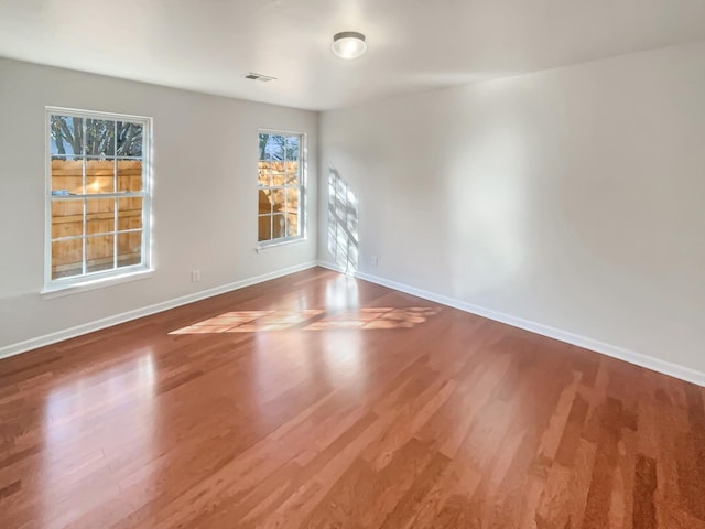 spare room featuring hardwood / wood-style floors