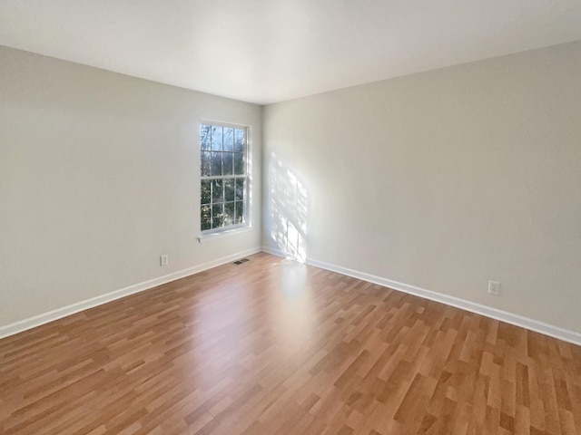 empty room featuring hardwood / wood-style flooring