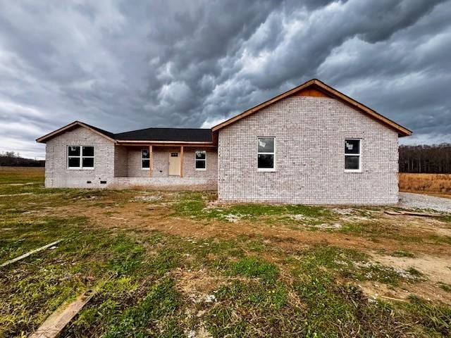 back of house with a yard