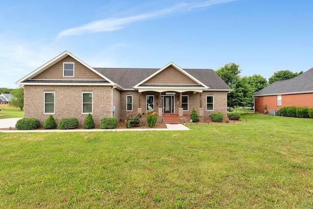 craftsman inspired home featuring covered porch and a front lawn