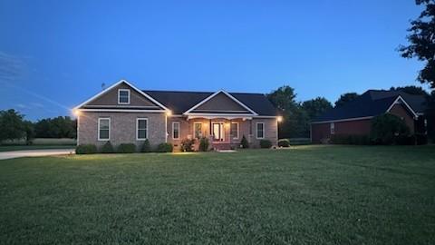 view of front of property with a lawn