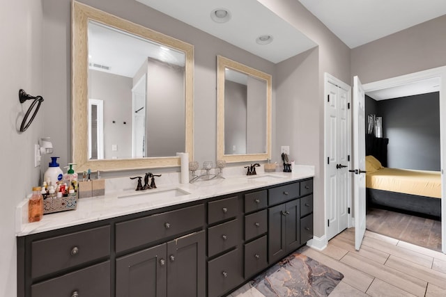 bathroom featuring vanity and wood-type flooring