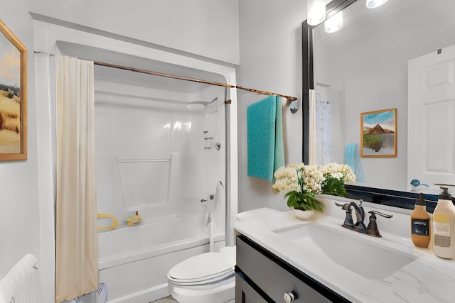 full bathroom featuring shower / tub combo with curtain, vanity, and toilet