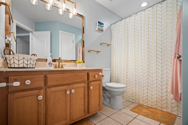 bathroom with tile patterned floors, vanity, curtained shower, and toilet