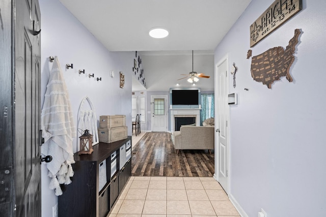 interior space featuring light wood-type flooring and ceiling fan