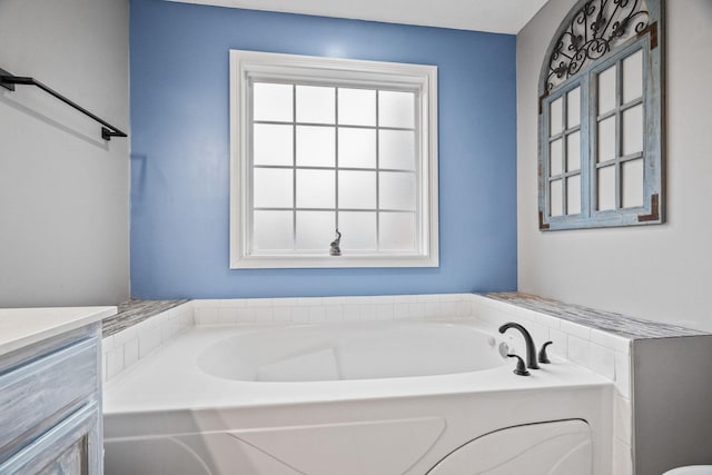 bathroom with a bathtub and vanity