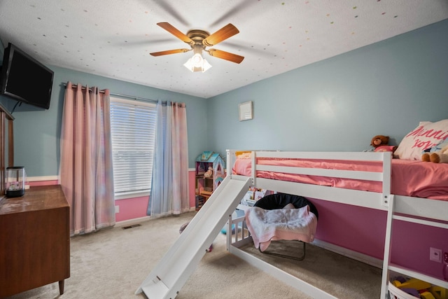 bedroom with ceiling fan and carpet