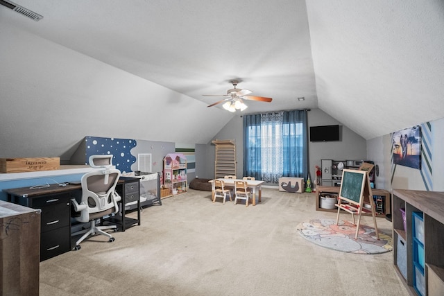 carpeted office space featuring a textured ceiling, ceiling fan, and lofted ceiling