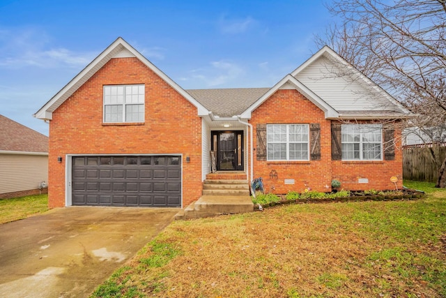 view of front of property with a front yard and a garage