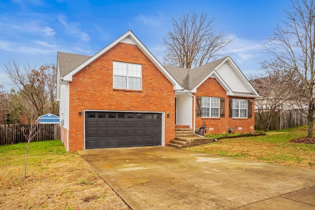 view of front of property featuring a front lawn and a garage