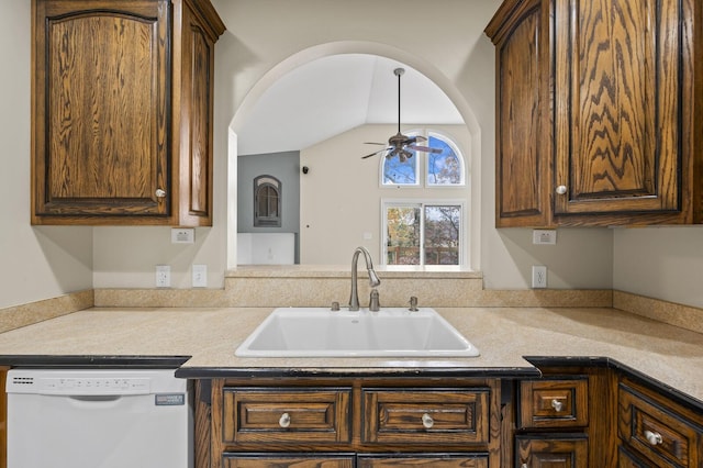 kitchen with ceiling fan, dishwasher, lofted ceiling, and sink