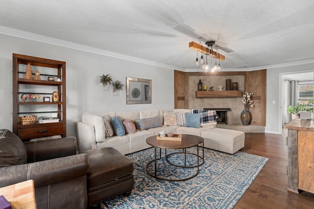 living room with a textured ceiling, dark hardwood / wood-style flooring, and crown molding