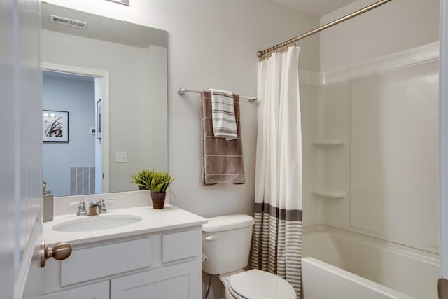 full bathroom with shower / bath combo, vanity, and toilet