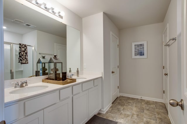 bathroom featuring a shower and vanity