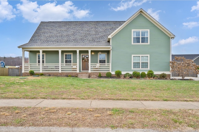 view of front of house with covered porch and a front lawn