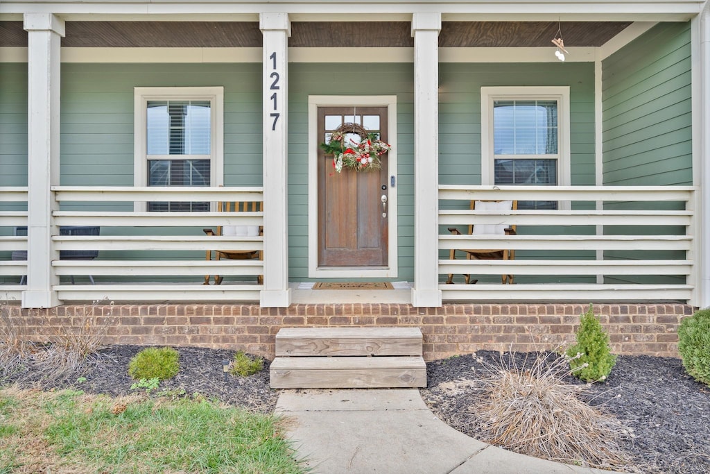 property entrance with a porch