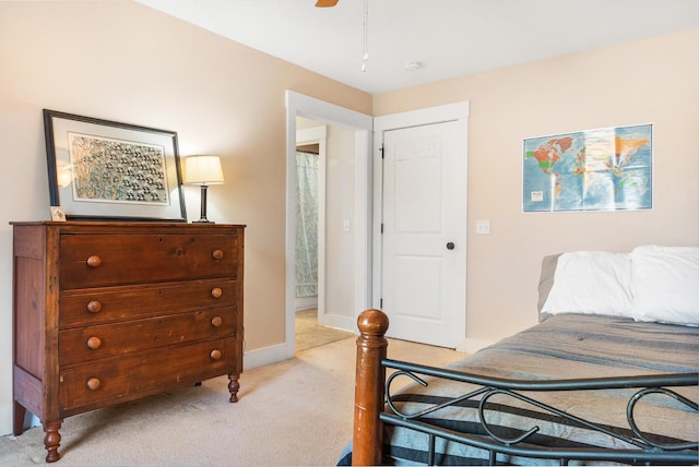 bedroom featuring ceiling fan and light carpet