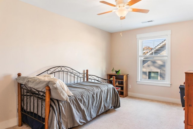 bedroom featuring light carpet and ceiling fan