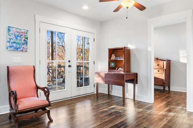 living area featuring french doors, dark hardwood / wood-style flooring, and ceiling fan