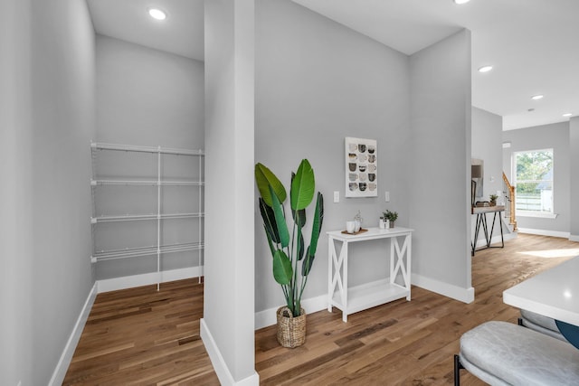 stairs with hardwood / wood-style floors