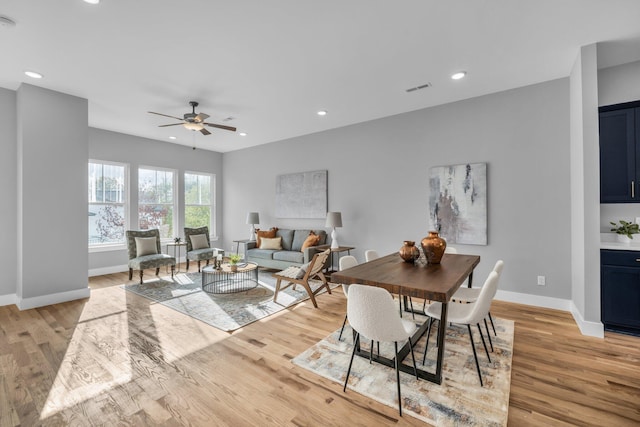 dining room featuring ceiling fan and light wood-type flooring