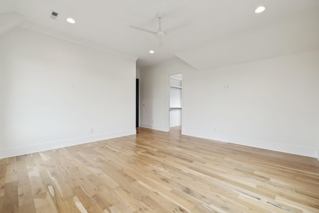 spare room with light hardwood / wood-style floors and ceiling fan