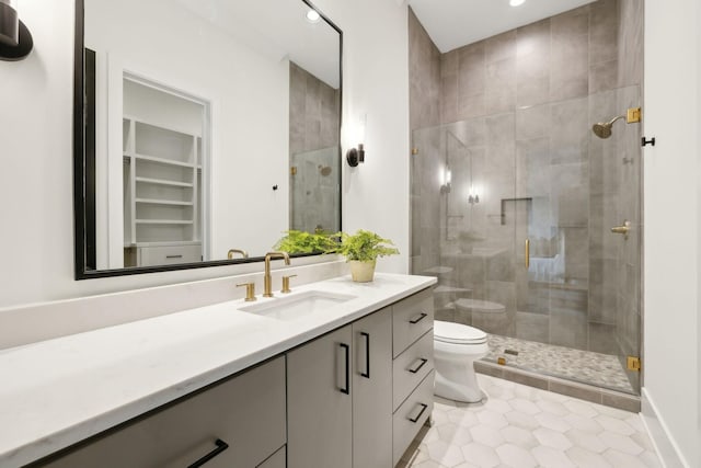 bathroom featuring vanity, an enclosed shower, tile patterned floors, and toilet