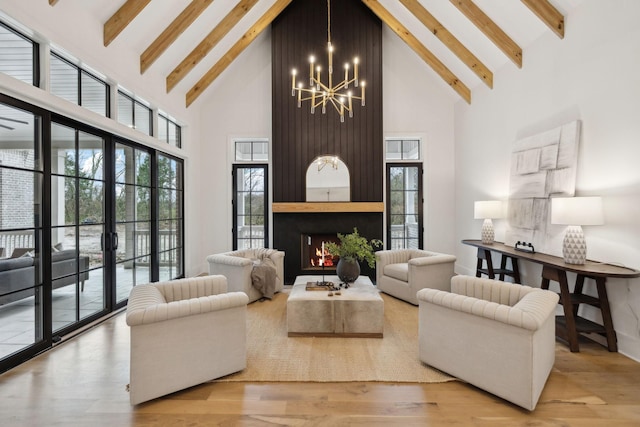 8901 Palmer Way, Brentwood, TN 37027 - living area featuring high vaulted ceiling, a chandelier, beam ceiling, and wood finished floors