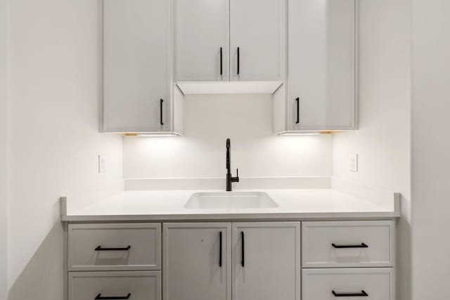 kitchen with white cabinets and sink