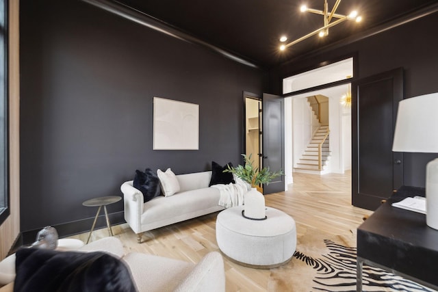 8901 Palmer Way, Brentwood, TN 37027 - living area featuring light wood-type flooring, stairs, and a chandelier