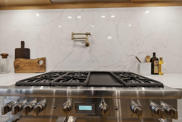 kitchen with range and decorative backsplash